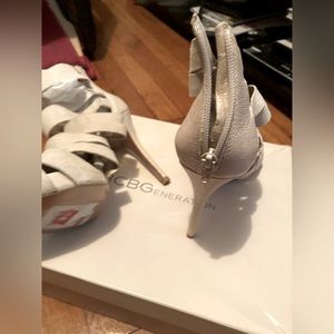 beige colored high -heeled shoes. New and never worn. Size 8 1/2. 3in heels.